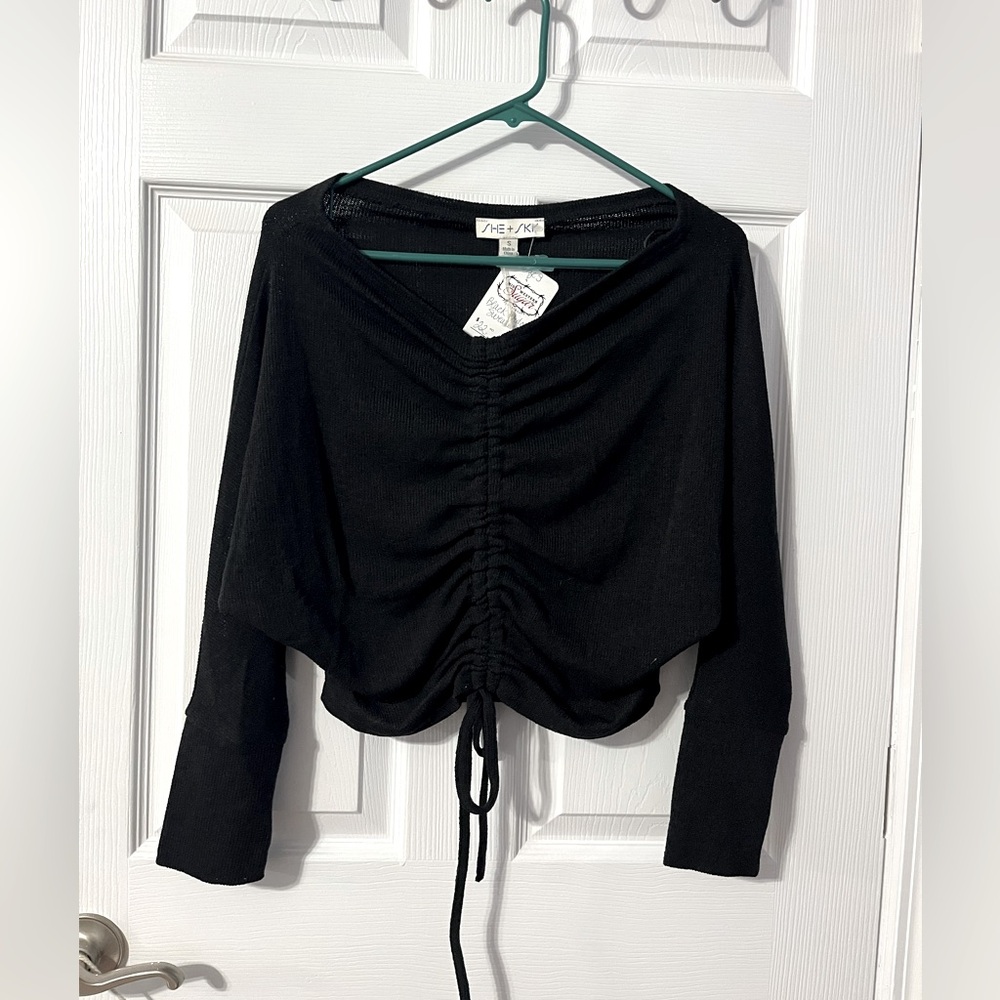 Women’s black cropped sweater with front gather.  Brand new, with tags.  Sz. S